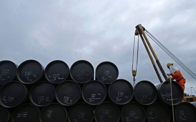 A worker prepares to transport oil pipelines to be laid for Pengerang Gas Pipeline Project in Johor